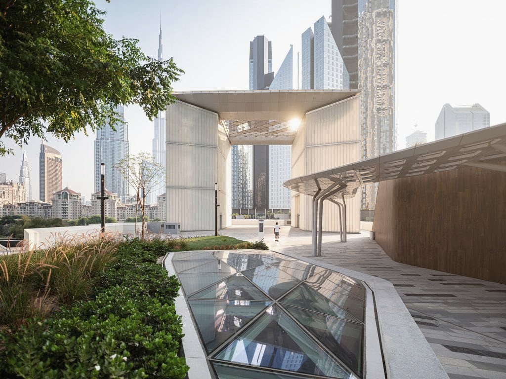 Contemporary limestone architecture in Dubai with skyline beyond