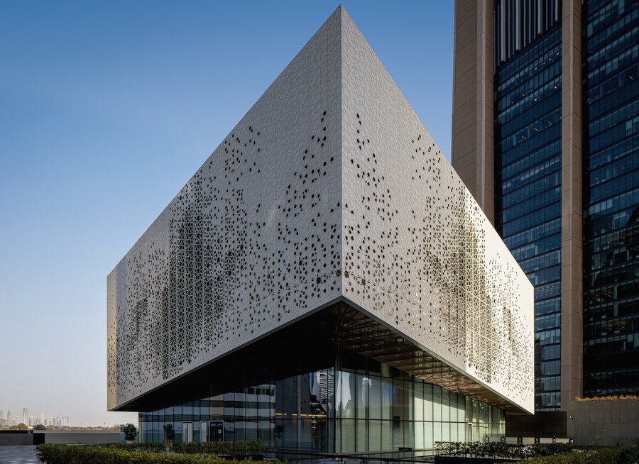 Modern perforated metal facade detail, abstract institutional architecture